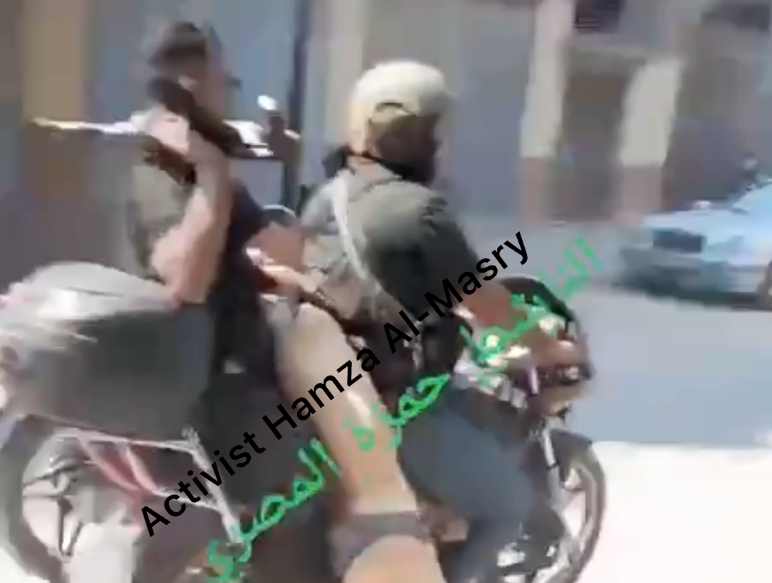 EXTREMELY GRAPHIC Video: Armed Gazan Civilians Who Participated In The Attack Carrying The Naked Body Of A Dead Israeli Person