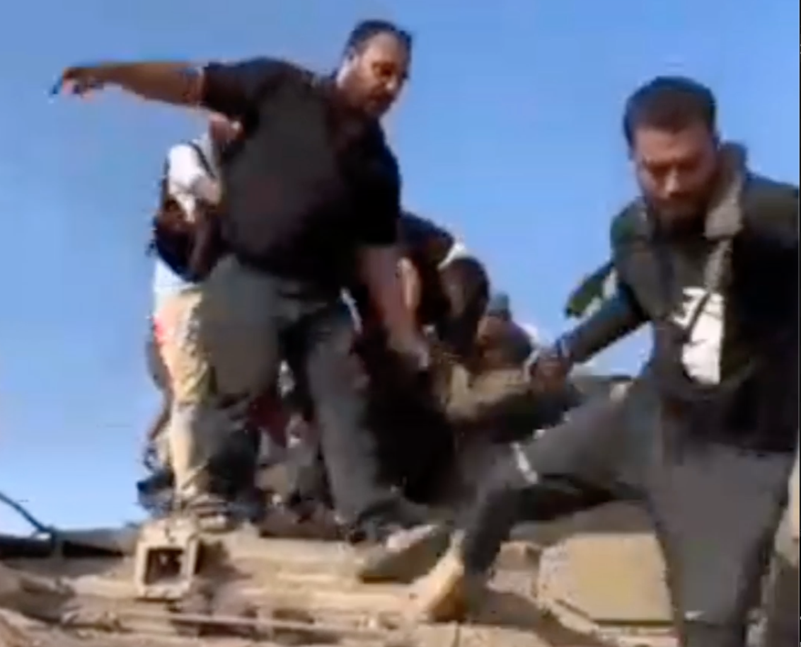 EXTREMELY GRAPHIC Video: A Dead Soldier Is Taken Out Of The Tank By Hamas Terrorists, And His Body Is Being Beaten & Humiliated By Many Civilians
