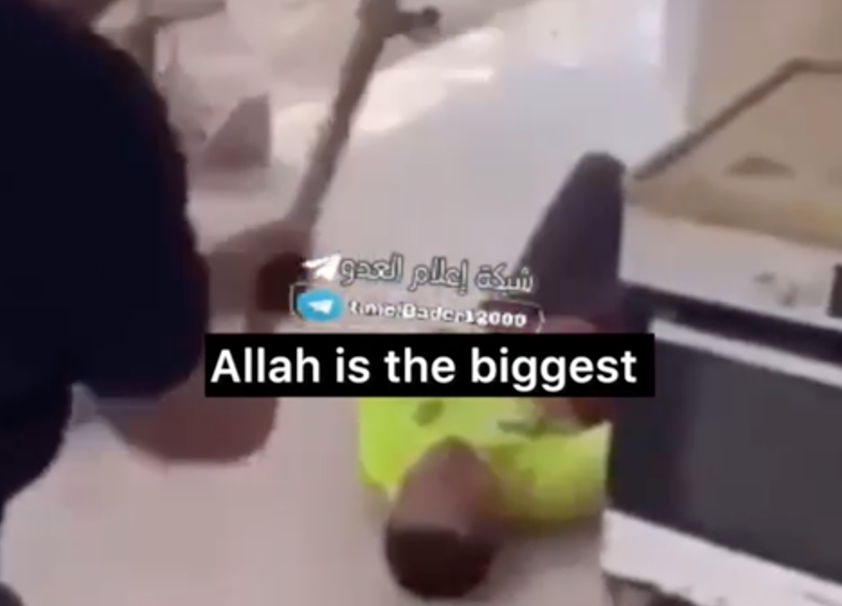 EXTREMELY GRAPHIC Video: A Civilian Is Lying On The Ground While Palestinians Argue About Who Will Get To Behead Him